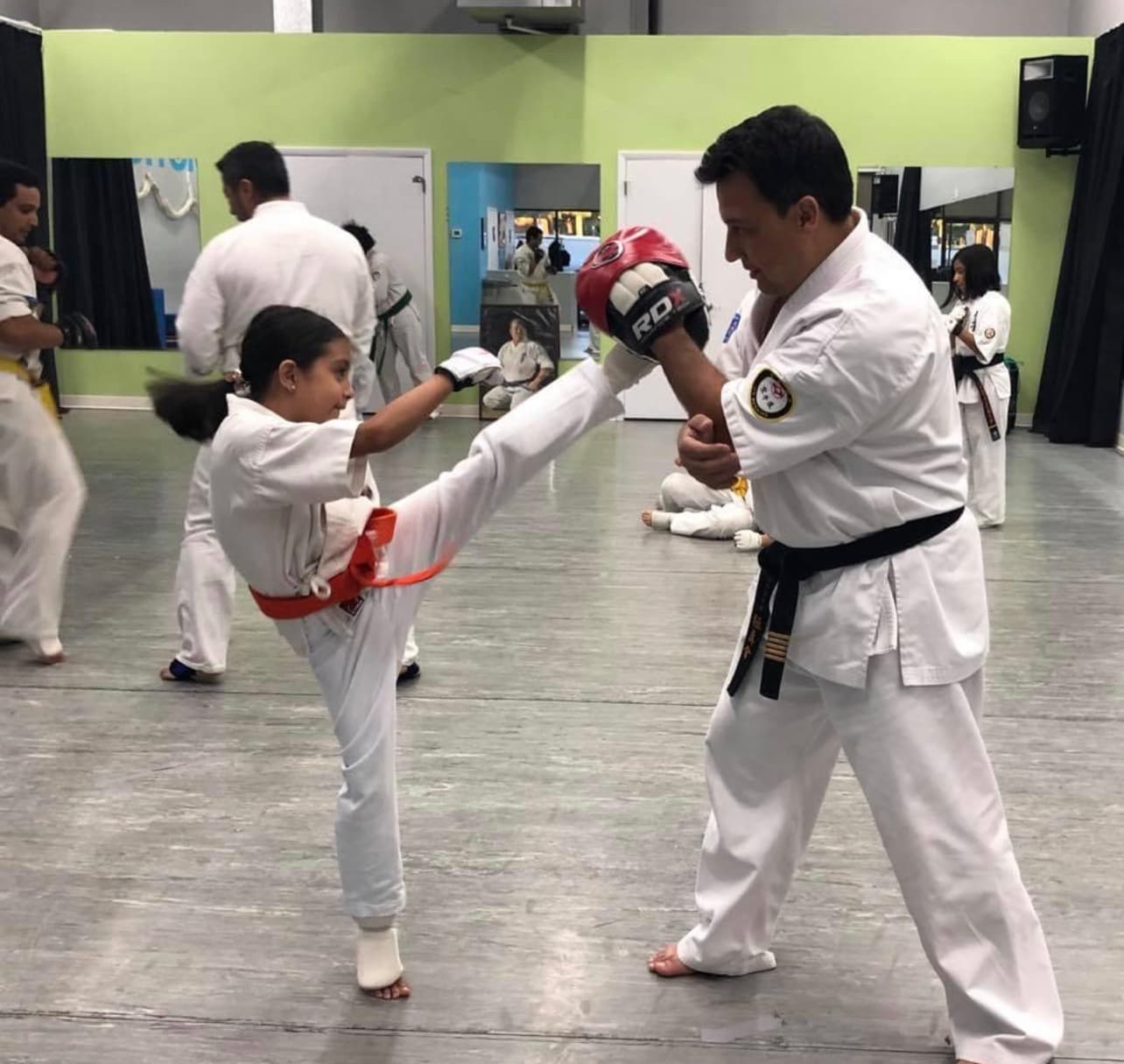 Kids karate training session with instructor guidance