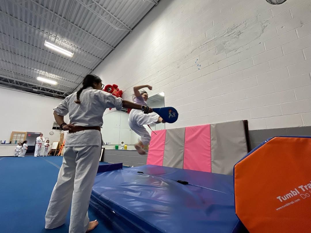 Children practicing karate forms together in Gaithersburg Maryland